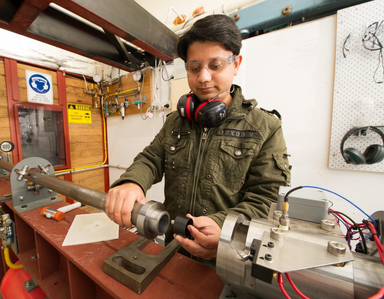 Man working with equipment at workbench